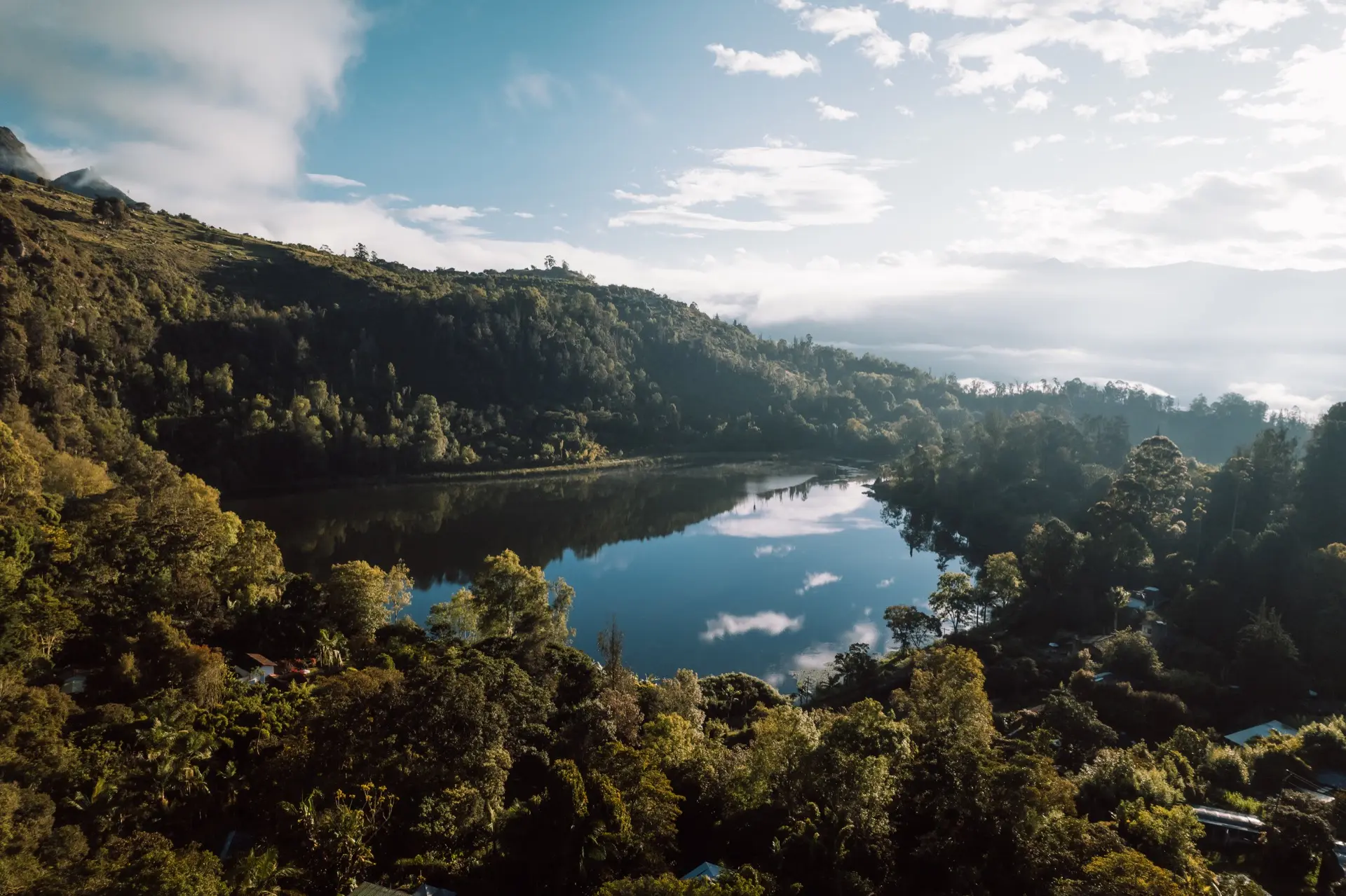 Ceremonial gathering inside a sacred Muiscan space with traditional textiles